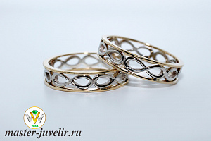 Свадебные обручальные кольца бесконечность в желтом и белом золоте